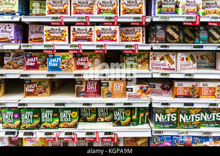 WELLINGTON, NEW ZEALAND - MARCH 1, 2017: Various cereal and nuts bars are displayed in a supermarket in Wellingtion in New Zealand capital city. Stock Photo