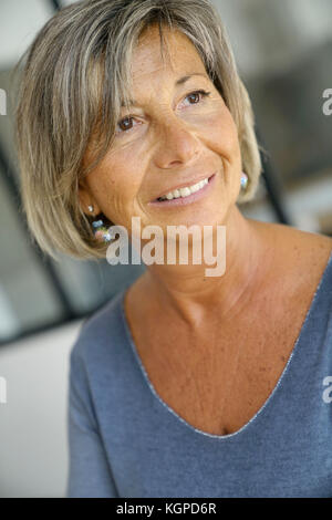 Portrait of senior woman with blue shirt Stock Photo