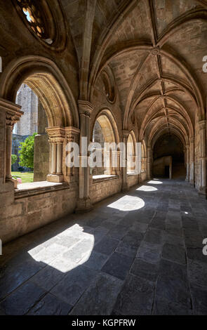 EVORA, PORTUGAL - JULY 01, 2016:  The interior of medieval cloister of Evora Cathedral (Se) with the massive arcade made of granite. Portugal Stock Photo