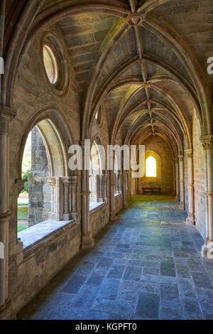 EVORA, PORTUGAL - JULY 01, 2016:  The interior of medieval cloister of Evora Cathedral (Se) with the massive arcade made of granite. Portugal Stock Photo