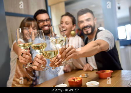 Portrait of friends in a bar drinking wine Stock Photo