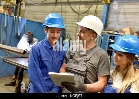 Young people in metallurgy training class Stock Photo