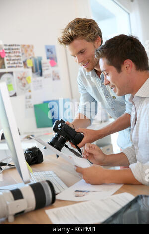 Photographers in studio agency working on project Stock Photo