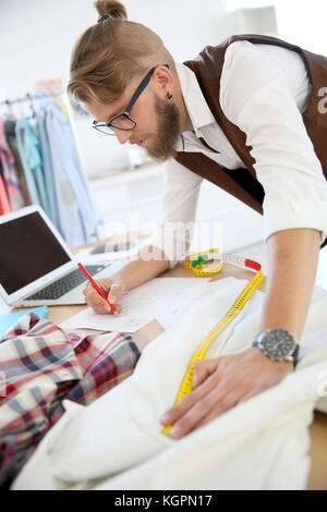 Fashion designer in workshop Stock Photo