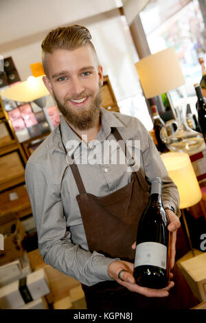 Man working in wine shop Stock Photo