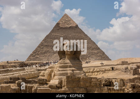 Great Sphinx in front of the Pyramid of Khafre on the Giza Plateau outside of Cairo, Egypt. Stock Photo