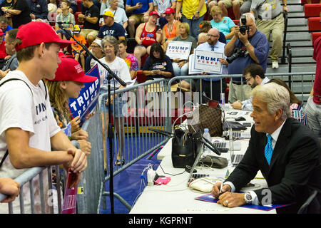 Mechanicsburg, PA – August 1, 2016: A Trump supporter asks John Roberts, Fox News Correspondent, for an autograph on a campaign sign at the Donald Tru