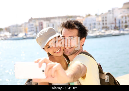 Couple taking picture of themselves during vacation Stock Photo