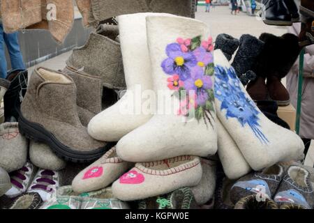 warm felted shoes made from sheep wool.feet warm in winte. Stock Photo