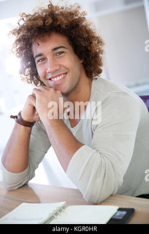 Cheerful businessman sitting in home-office Stock Photo
