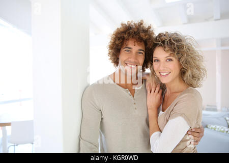 Attractive smiling couple in new home Stock Photo
