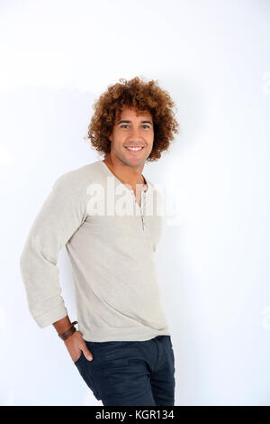 Cheerful handsome guy standing on white background Stock Photo