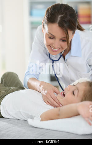 Doctor checking on child's ear Stock Photo