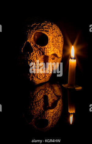 Carved human scull in a moment of nostalgia. Stock Photo