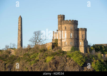 Historic buildings on Calton Hill, Edinburgh: The Martyrs Monument and Governors House of the old Calton Jail. Stock Photo