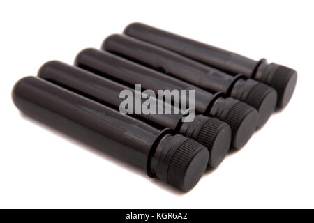 Four Pet Bottle Preforms on white background Stock Photo