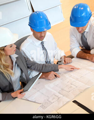 Architects and businesswomen working on construction project Stock Photo