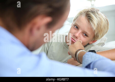 Daddy talking to his son about serious things Stock Photo