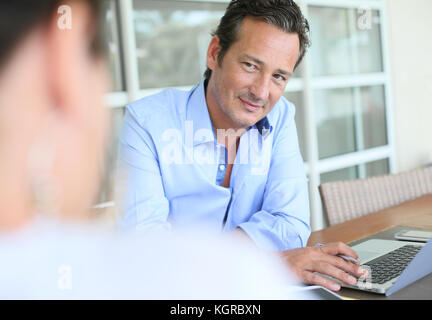 Businessman meeting client in office Stock Photo