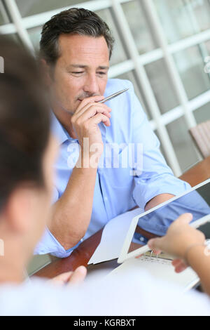 Businessman meeting client in office Stock Photo