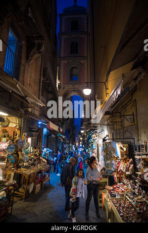 NAPLES, ITALY - OCTOBER 16, 2017: Night time view of the 'Christmas Alley' (Via San Gregorio Armeno) home to the Neapolitan Presepi (Nativity scene). Stock Photo