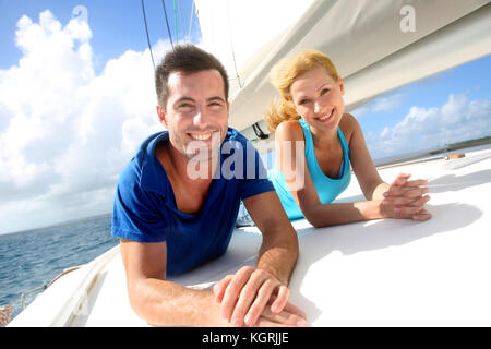 Cheerful couple cruising on a sail boat Stock Photo