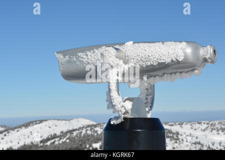 Spy viewing machine on the top of the mountain, winter conditions, close up view Stock Photo