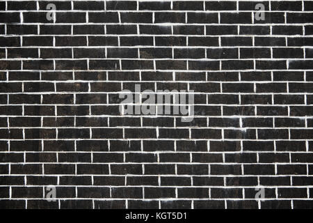 Old dark brick wall texture or background. Stock Photo