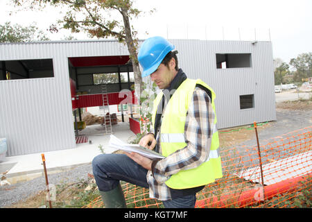 Construction manager using electronic tablet on site Stock Photo