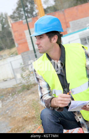 Construction manager using electronic tablet on site Stock Photo