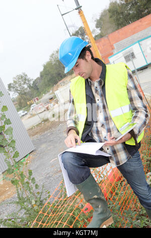 Construction manager using electronic tablet on site Stock Photo