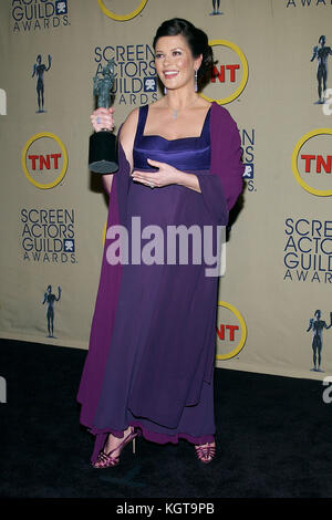 Catherine Zeta-Jones backstage at the 9th Annual Screen Actor Guild Awards at the Shrine Auditorium in Los Angeles. March 9, 2003.Catherine Zeta Jones 041  = People, Vertical, Full Length, USA, California, City Of Los Angeles, One Person,  Portrait, Photography, Catherine Zeta Jones, Arts Culture and Entertainment, Looking at the Camera, Wavy Hair Stock Photo