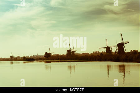 Landscape old quality of  Kinderdijk district popular tourist destination with it's scenic fields, ponds, canls and windmills. Stock Photo