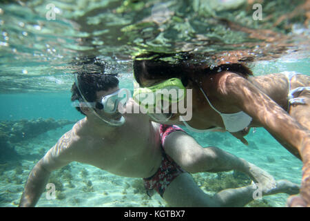 Couple snorkeling in Caribbean waters Stock Photo