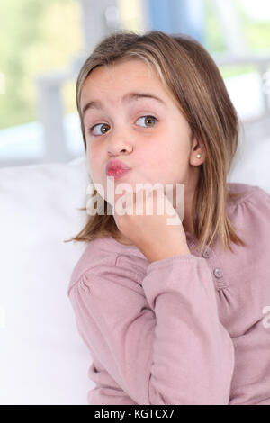 Portrait of little girl with doubtful look Stock Photo
