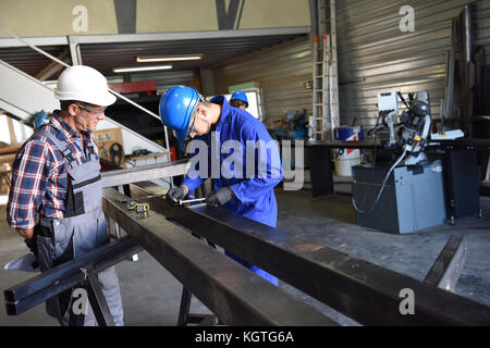 Metalwork student training in workshop Stock Photo