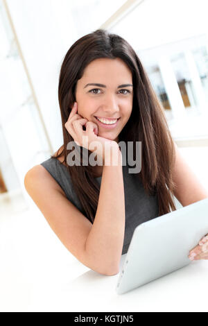 Portrait of smiling student using electronic tablet Stock Photo