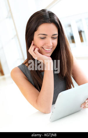 Portrait of smiling student using electronic tablet Stock Photo