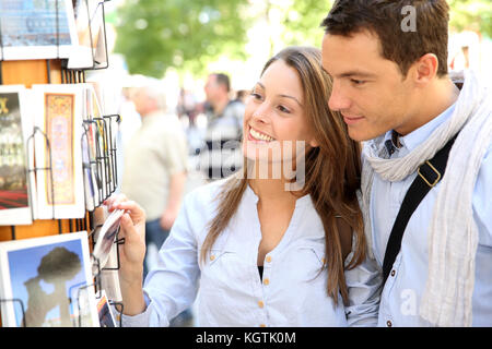 Couple in Madrid looking at postcards Stock Photo
