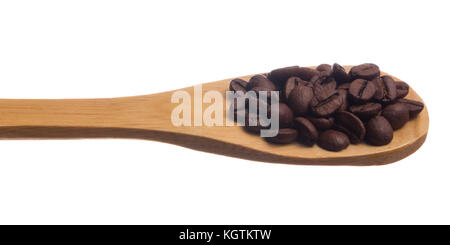 Selection of roasted coffee beans seed. Grains over wooden spoon, isolated white background. Stock Photo