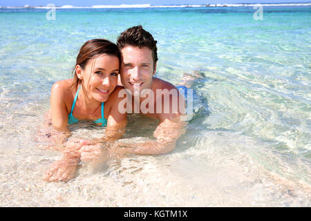 Portrait of cheerful couple in Caribbean sea Stock Photo