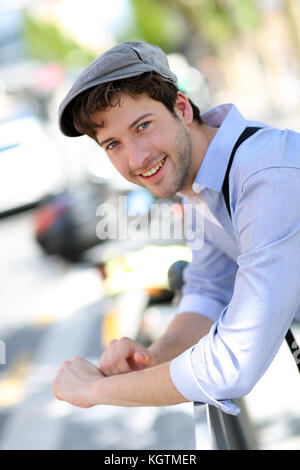 Portrait of young trendy guy standing outside Stock Photo