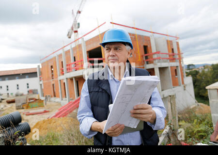 Building entrepreneur using digital tablet Stock Photo