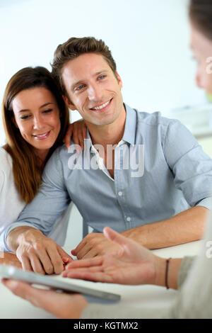 Young couple meeting financial adviser Stock Photo
