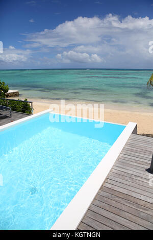 Beautiful view of infinity pool with wooden deck Stock Photo