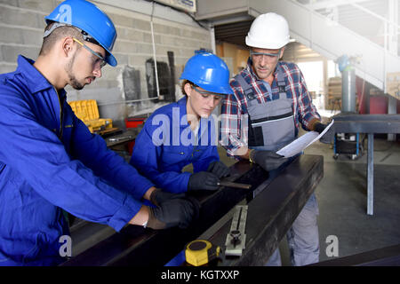 Metalwork students training in workshop Stock Photo