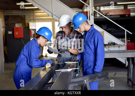 Metalwork students training in workshop Stock Photo
