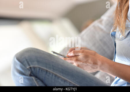 closeup of woman's hand using smartphone Stock Photo