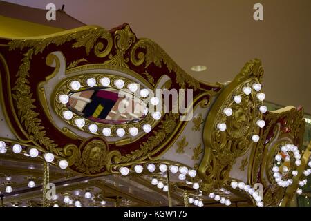 Close up view of vintage looking carousel (merry-go-round) adorned with modern energy saving lights Stock Photo