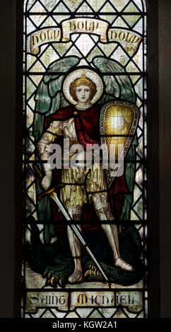 Saint Michael and the devil stained glass, St. Michael and All Angels Church, All Stretton, Shropshire, England, UK Stock Photo